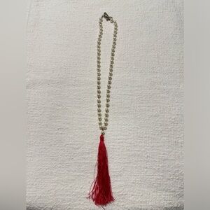 Pearl necklace with pink tassel